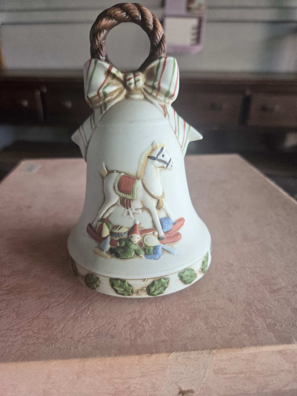 Holiday Music Box Ceramic Bell with Rocking Horse Motif - White
